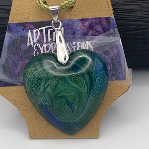Resin swirled pendant.